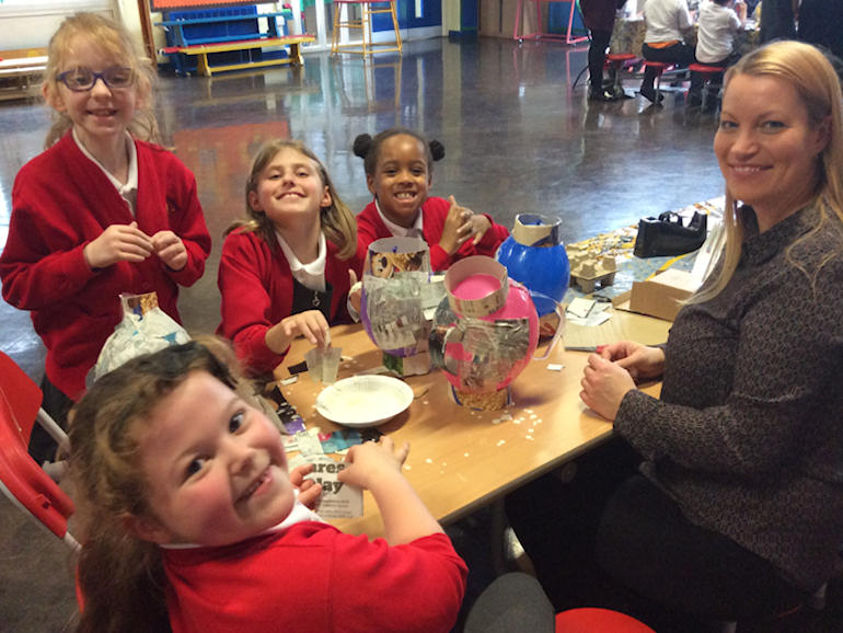 Making papier mache models with our parents