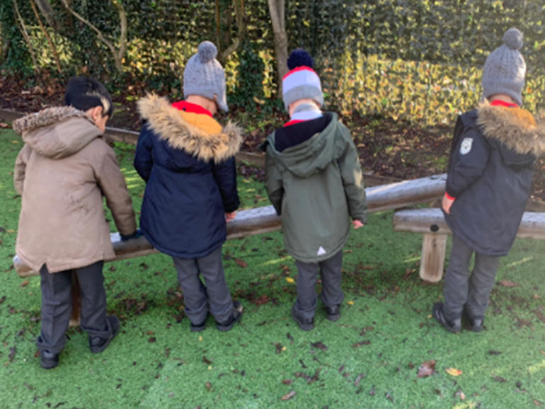 Reception children working outside